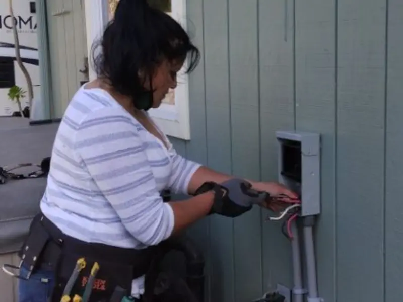 Licensed electrician wiring an exterior subpanel in Worland