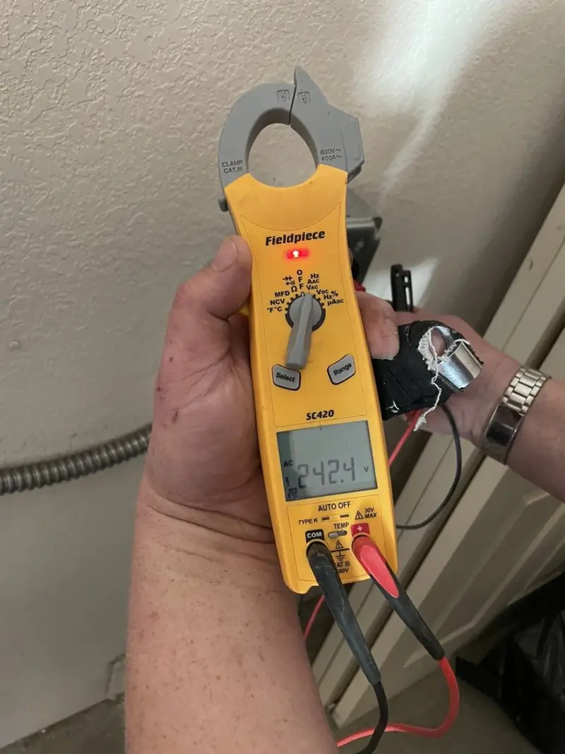 Voltage testing with clamp meter during Electrical Installation Services in Worland